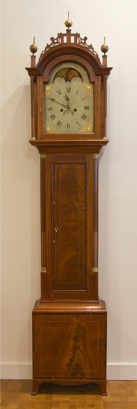 Hepplewhite tall clock. Boston, c. 1805. Mahogany and veneer with inlay. Collection of the Cape Ann Museum, Bequest of E. Hyde Cox, 1998 [Acc. #1998.36].