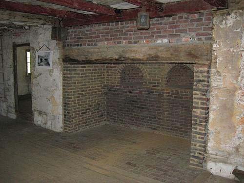 The kitchen fireplace with two bake ovens as it appears today.